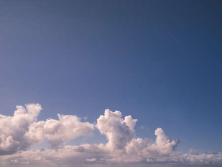 Panorama evening sky with blue, white and orange cloudsの写真素材