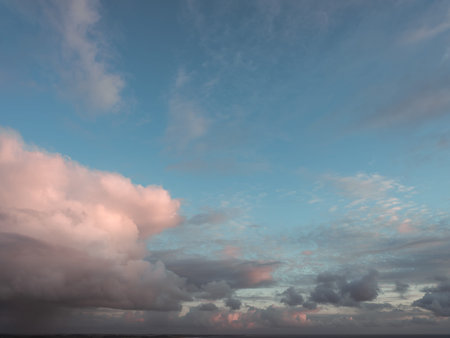 Panorama evening sky with blue, white and orange clouds