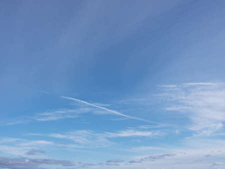 Panorama evening sky with blue, white and orange cloudsの写真素材
