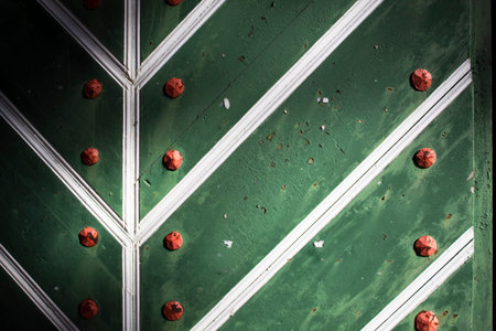 close up of a metal plate with a green background