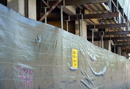 part of new bilded wall on construction site with steel rails and concete elements.の写真素材