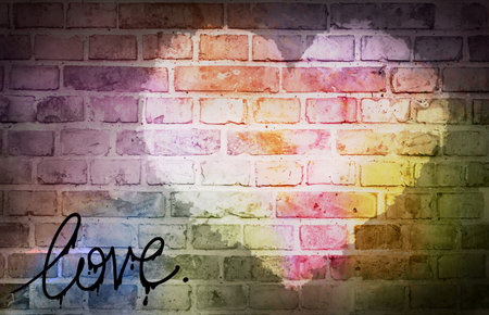 Heart and love inscription pattern on texture of old brick wall with mortar in gaps between bricks. With rainbow color.の写真素材