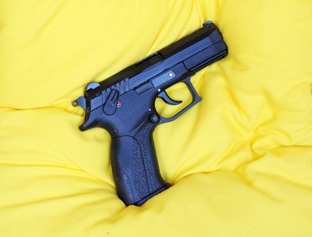 Gas gun on yelloq pillowの写真素材