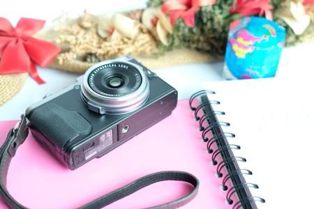 Dhaka, bangladesh, august 2017- fuji x70 a mirrorless camera with fixed lens and travel planner diary taken on 17, august 2017.のeditorial素材