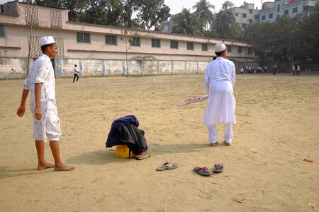 Dhaka, bangladesh - January 2018 - Big group of young people playing cricket in the streets of Malibagh at Dhaka in bangladesh taken at 10th january 2018のeditorial素材