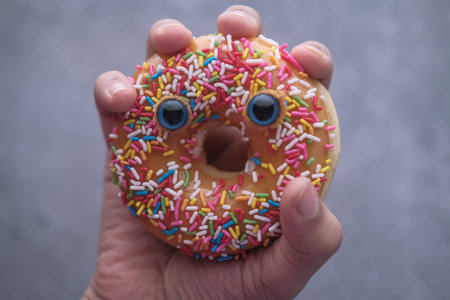 Close up of donut with funny face.