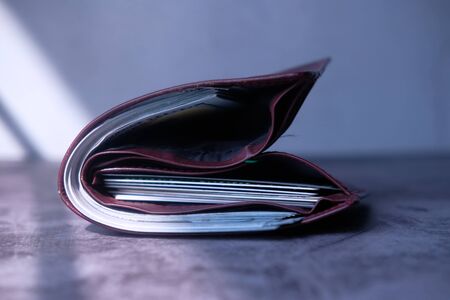 close up of wallet and cash on tableの写真素材