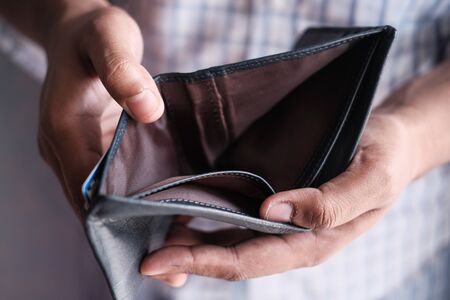 man hand with empty wallet, debt conceptの写真素材