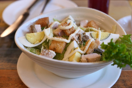 close up of chicken salad in a bowl on table .の写真素材