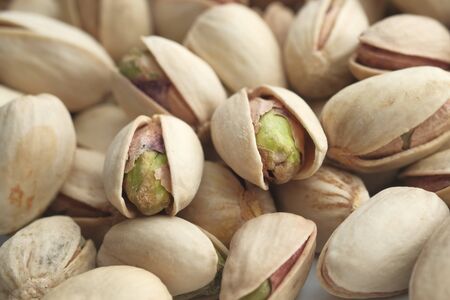 Close up of baked pistachios on table.の写真素材