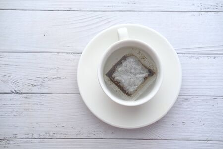 top view of green tea bag in a tea cup.の写真素材