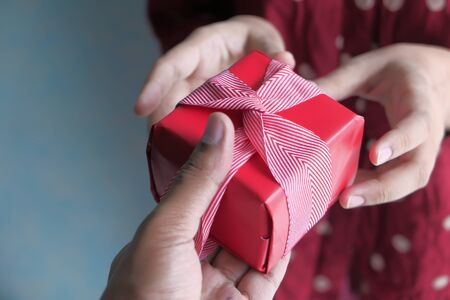 close up of women hand holding gift box.の写真素材