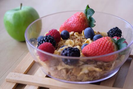 Close up of berry fruit on oat in a bowl.の写真素材