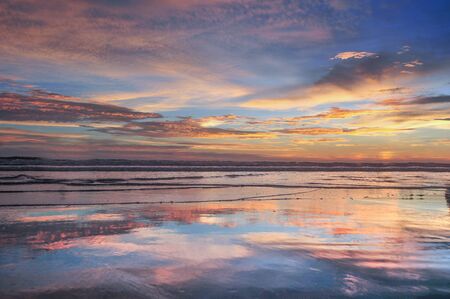 sea beach sky reflect on water in cox's bazar in bangladesh.の写真素材