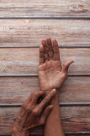 top view of senior women suffering wrist pain .の写真素材