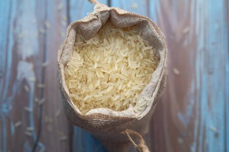 top view of raw rice in a bag on tableの写真素材