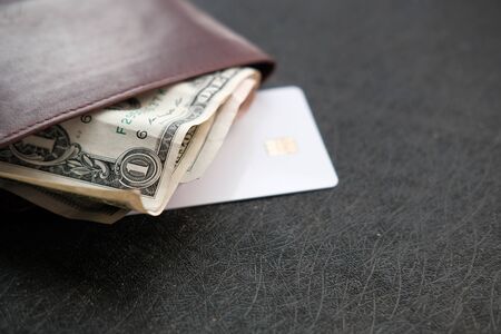 Close up of credit card and cash in walletの写真素材
