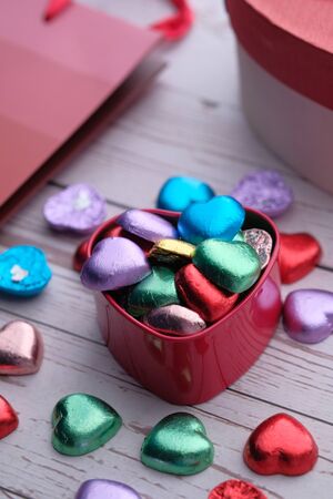 Closeup of heart shape candy in a gift box on table.の写真素材