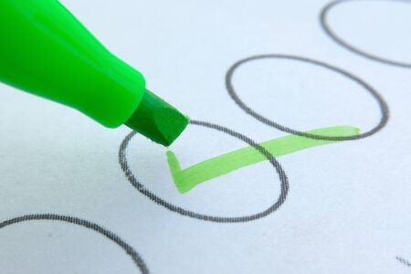 close up of check mark with pen on paperの写真素材