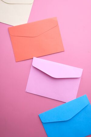 Close up of colorful envelope on color background.の写真素材