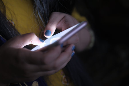 Close up of women use smart phone at night
