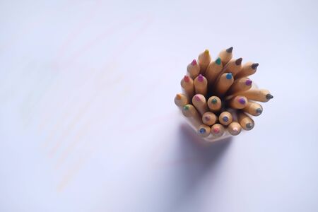 top view of colorful pencils on white backgroundの写真素材