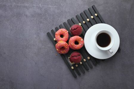 top view of coffee and donuts on tableの写真素材