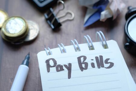 Close up of pay bills word on notepadの写真素材