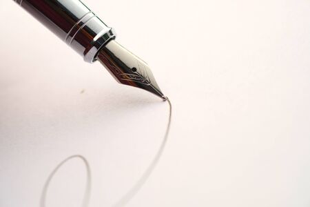 close up of fountain pen writing on paper.の写真素材