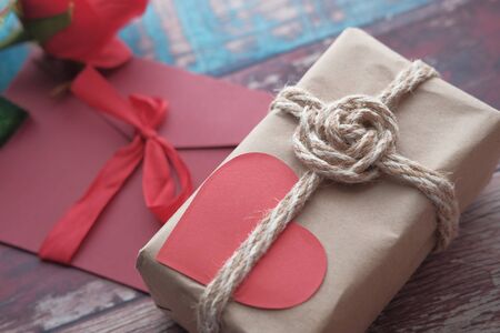 top view of heart shape gift box on red background.の写真素材