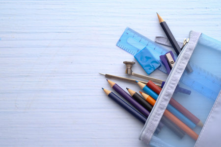 top view of school stationary on table with copy space.