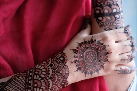 close up of hena decorative on hand womenの写真素材
