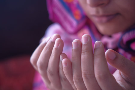 Close up of muslim women praying indoor