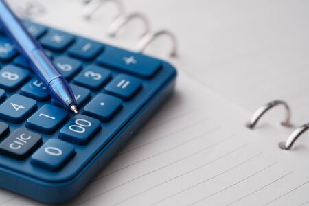Close up of pen on calculator on a diaryの写真素材