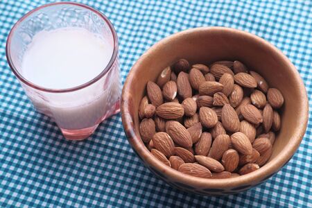 Close up of fresh almond and milk on tableの写真素材