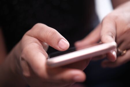 Close up of women use smart phone at nightの写真素材