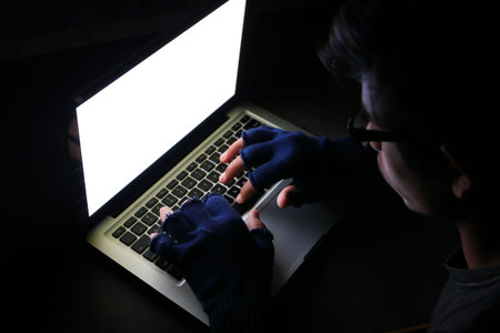 hacker stealing data laptop at night , closeup