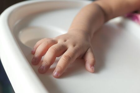 Close up of baby hand on white background.の写真素材