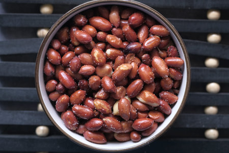 top view of fresh pea nut in a bowl on table.の写真素材