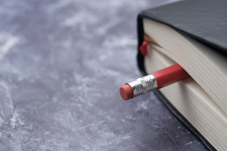 Close up of diary and pencil on table