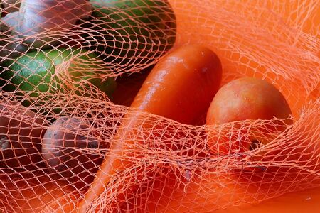 Close up of vegetable in reusable shopping bagの写真素材