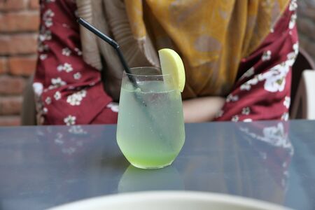 Close up of lime juice on cafe tableの写真素材