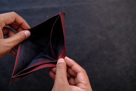 top view of man hand with empty wallet .
