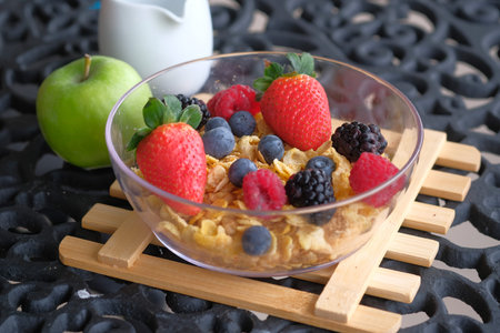 berry fruits on oats in a bowl for breakfast