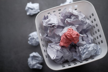 top view of crumbled paper balls in a bin
