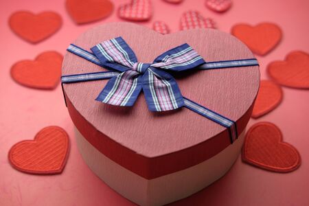 Close up of heart shape gift box on tableの写真素材