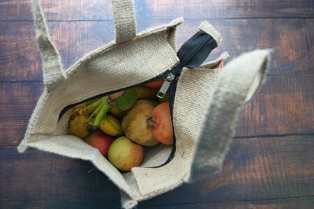 top view of fruits in a reusable shopping bagの写真素材
