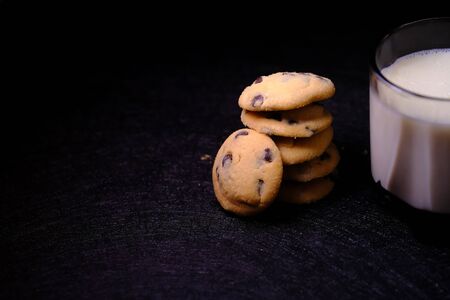 Close up of cookies and milk on tableの写真素材