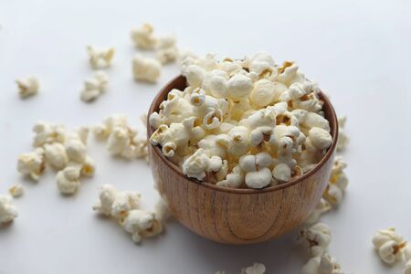 Close up of popcorn in a wooden bowlの写真素材