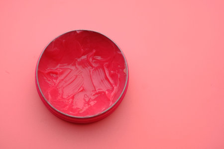 petroleum jelly on pink background, close up